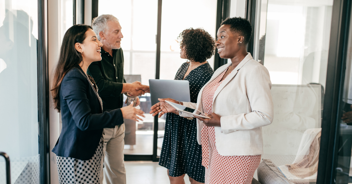 A hiring team welcomes a new hire to the team